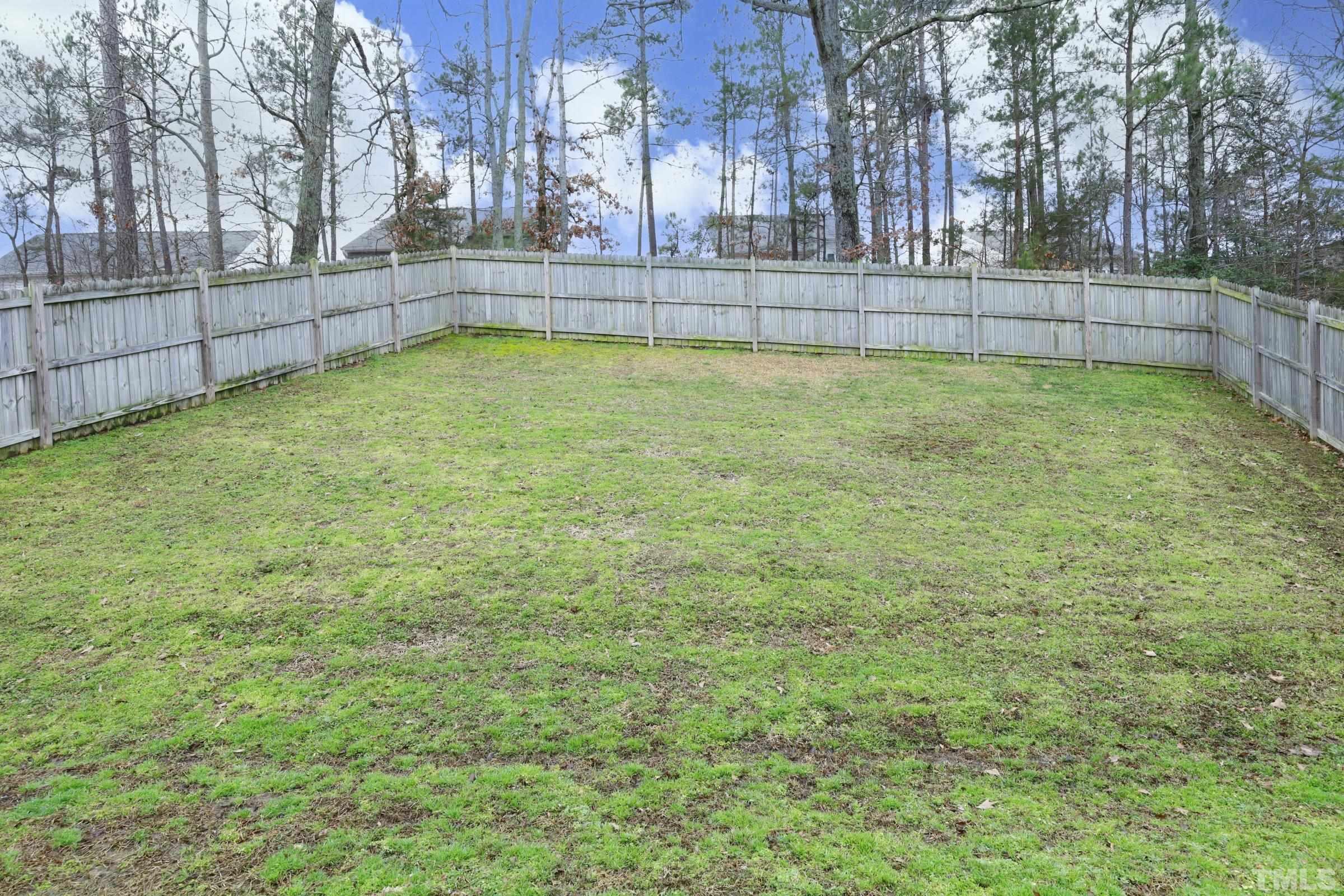 3608 Marshlane Way Raleigh, NC 27610 - Photo 38 of 43 a view of a yard with large trees