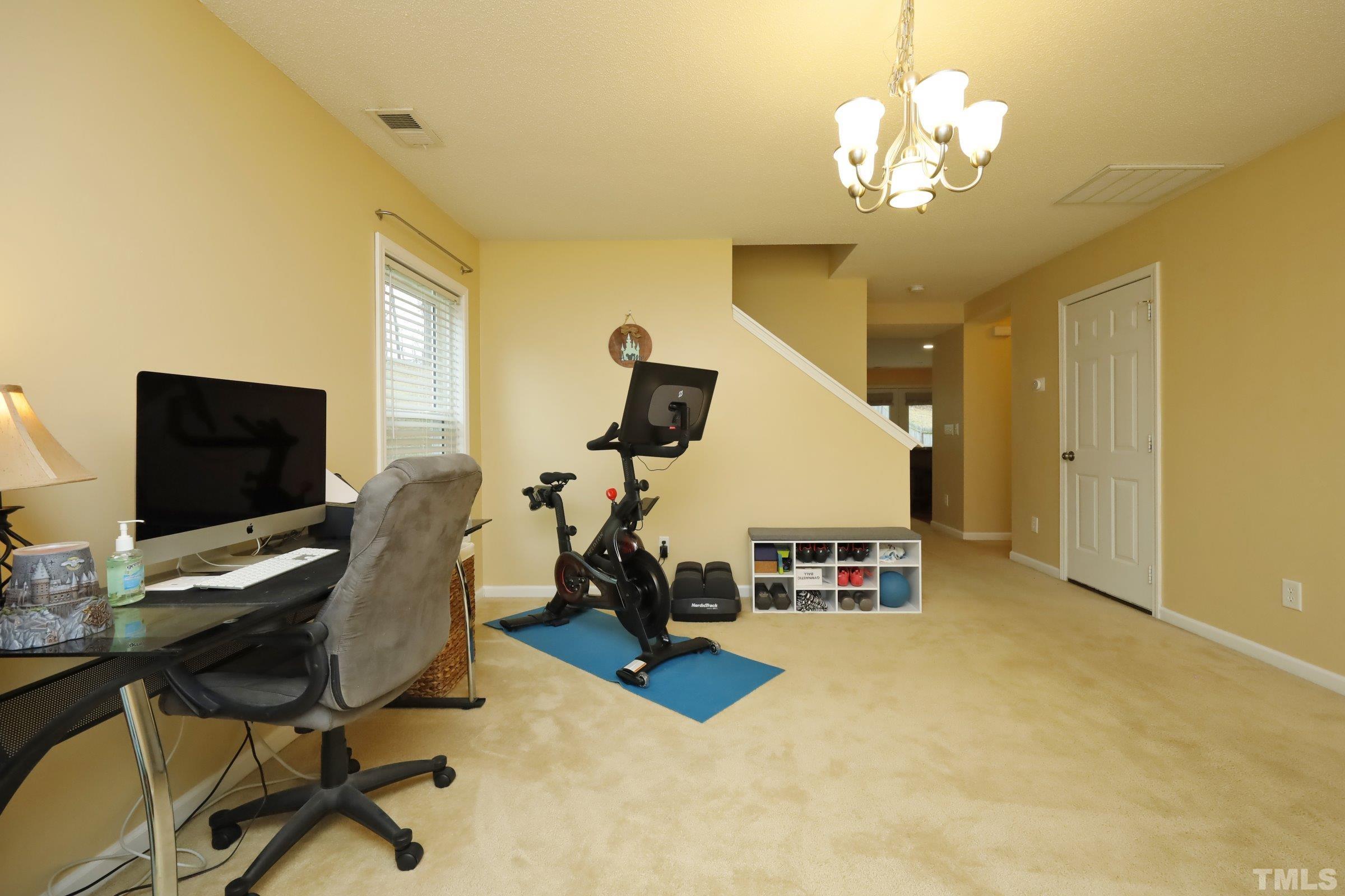 3608 Marshlane Way Raleigh, NC 27610 - Photo 4 of 43 a view of a livingroom with workspace and a window