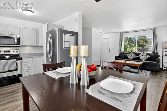 a living room with furniture and a table