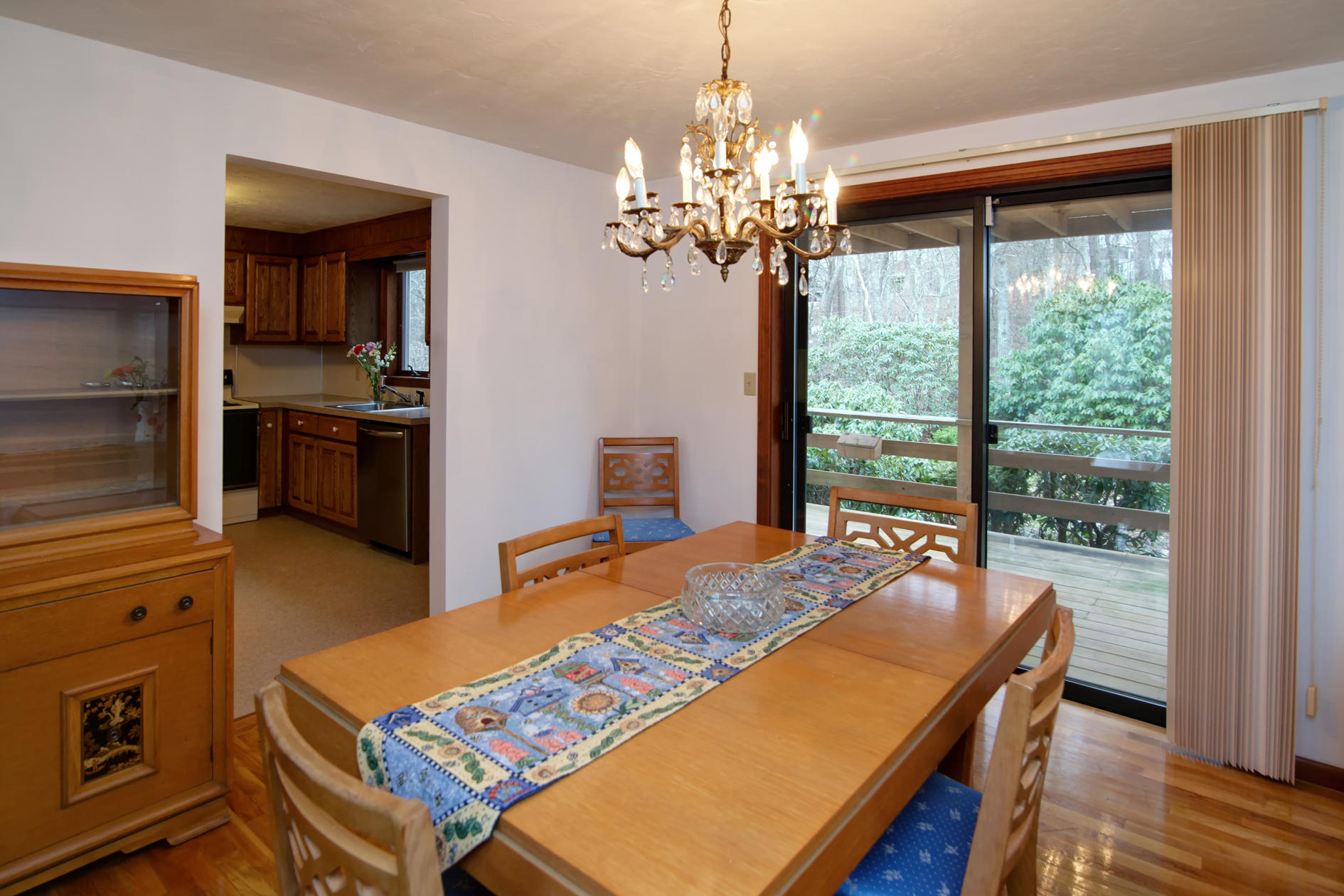 3 Easting Road Bourne, MA 02532 - Photo 12 of 35 a bedroom with a bed and a chandelier