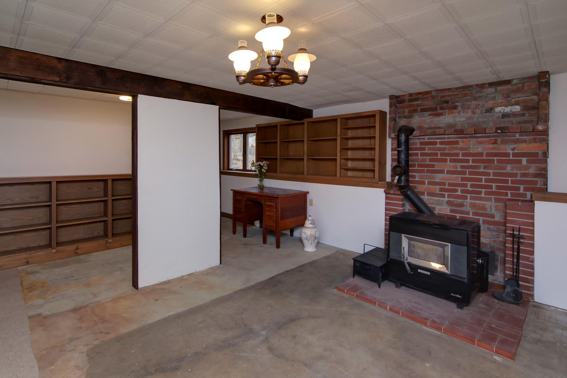 3 Easting Road Bourne, MA 02532 - Photo 35 of 35 a living room with furniture a chandelier and a fireplace