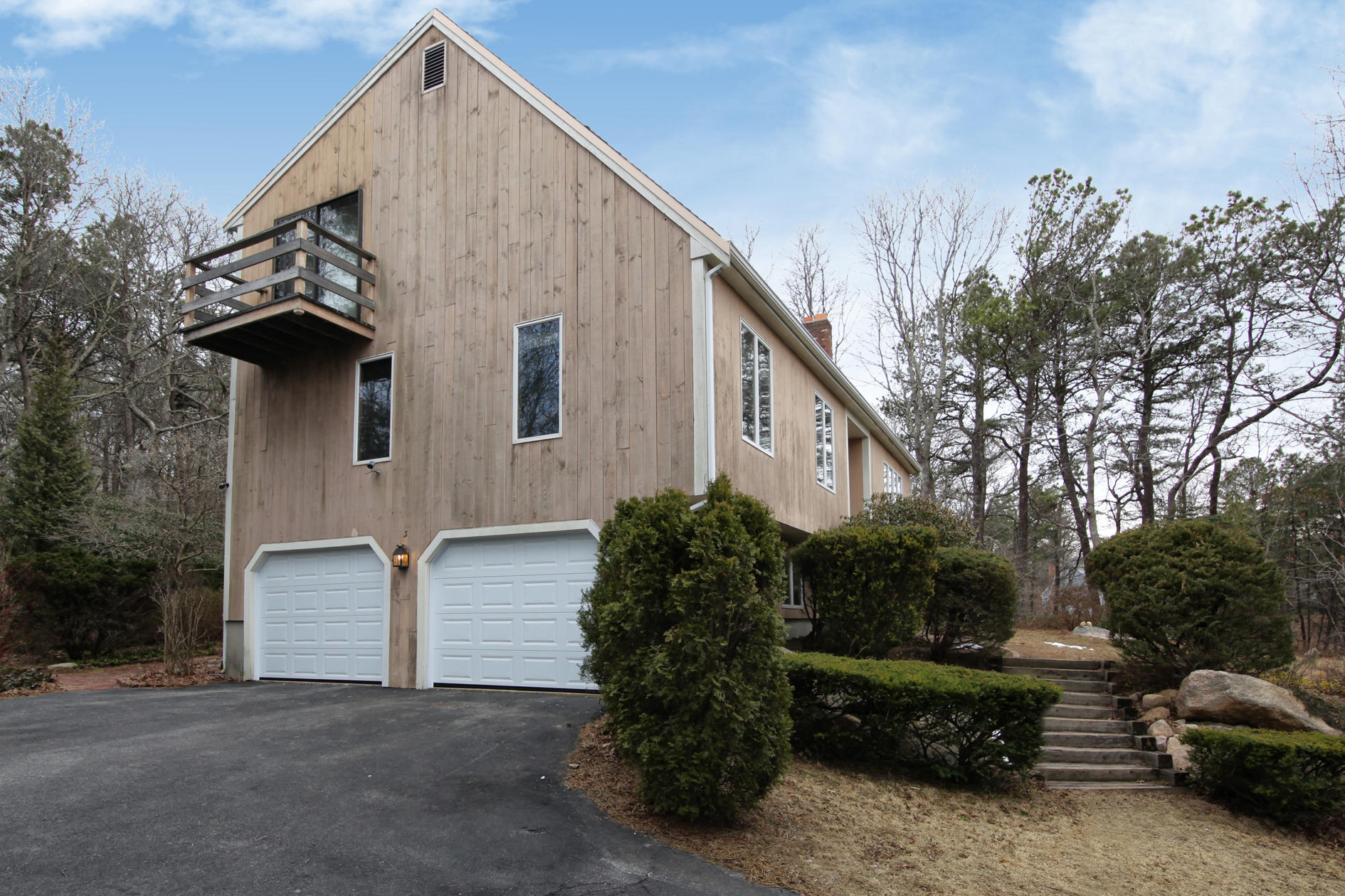 3 Easting Road Bourne, MA 02532 - Photo 6 of 35 a backyard of a house with potted plants and large tree