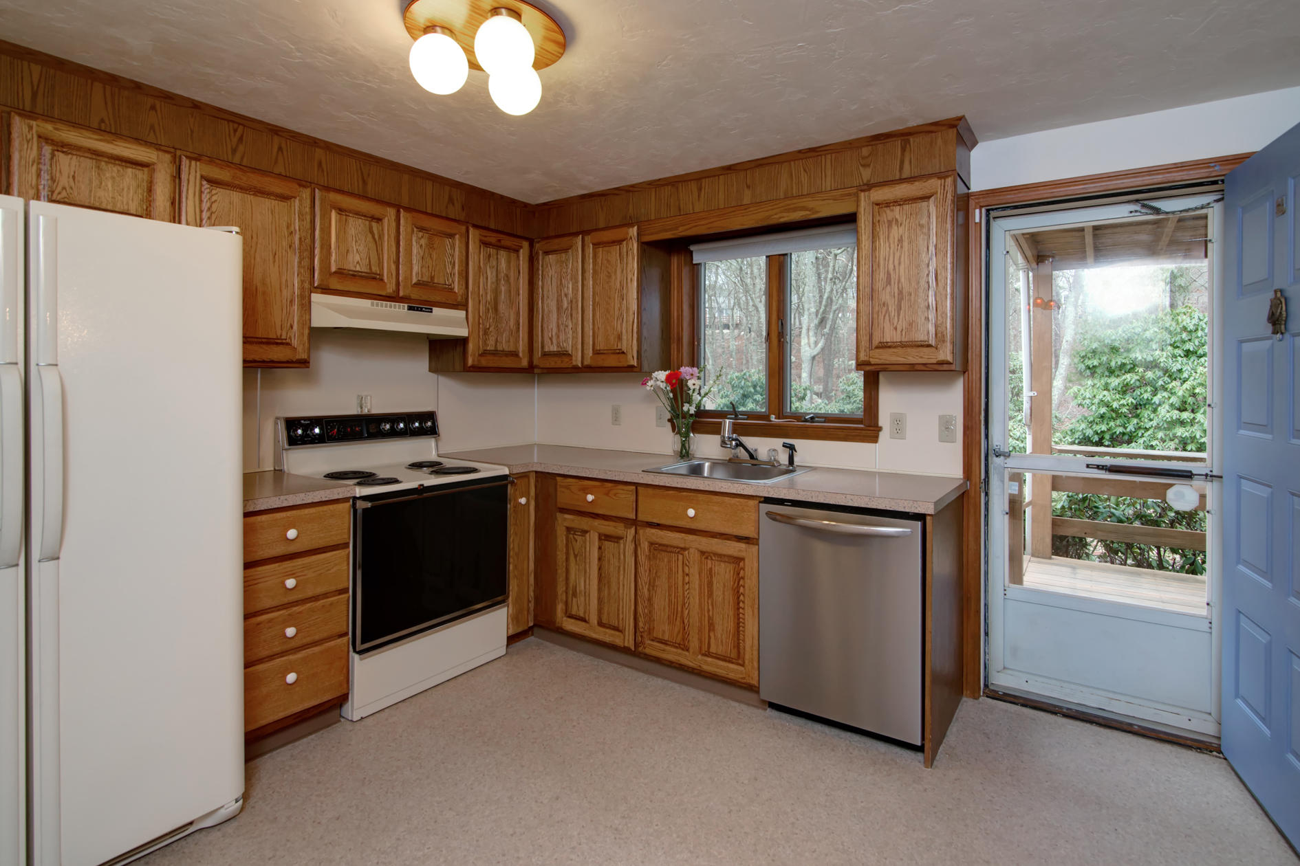 3 Easting Road Bourne, MA 02532 - Photo 8 of 35 a kitchen with stainless steel appliances granite countertop a refrigerator a stove a sink and a microwave