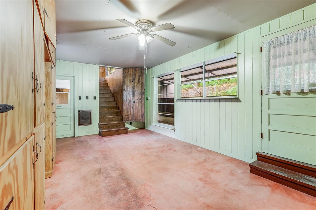 17234 West Reed Park Road Jonestown, TX 78645 - Photo 26 of 30 Den, office, study or craft room beside caport entry door; stairwell to upstairs private versatile room
