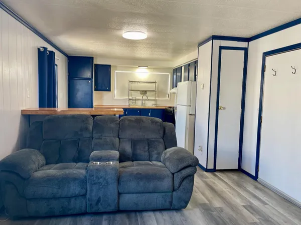 a living room with a couch and a window