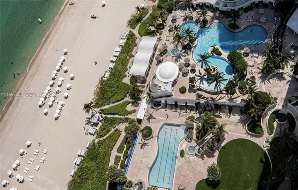 an aerial view of a house with outdoor space