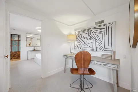 a room with table and chairs