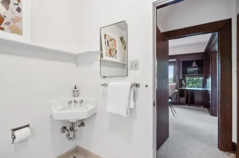 a bathroom with a sink and mirror
