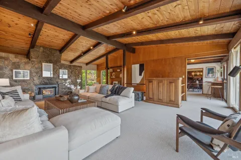 a living room with furniture and a table