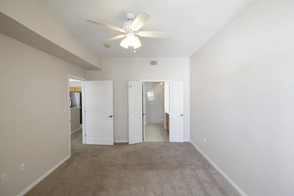 an empty room with a bathroom