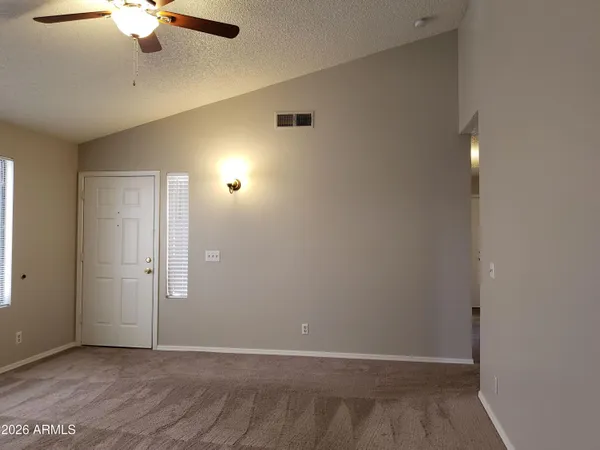 an empty room with fan