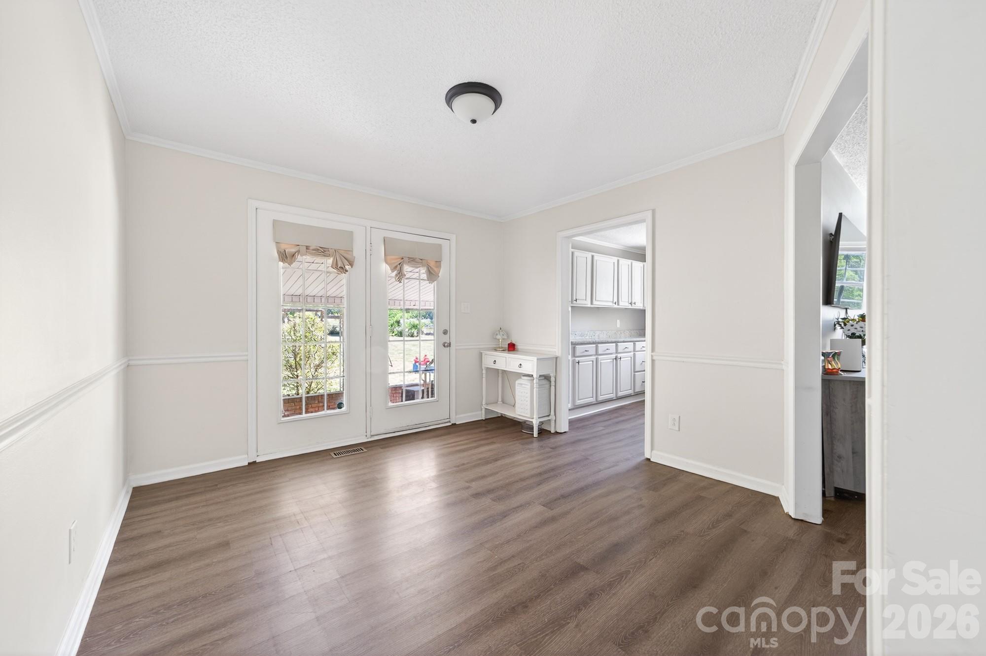 204 Harrelson Road Cherryville, NC 28021 - Photo 15 of 34 a view of an empty room with wooden floor and a window