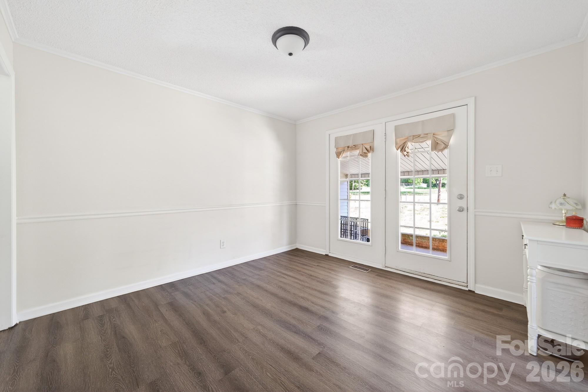 204 Harrelson Road Cherryville, NC 28021 - Photo 16 of 34 an empty room with wooden floor and windows
