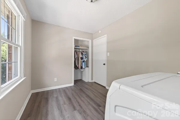 a bed room with a bed and a chandelier