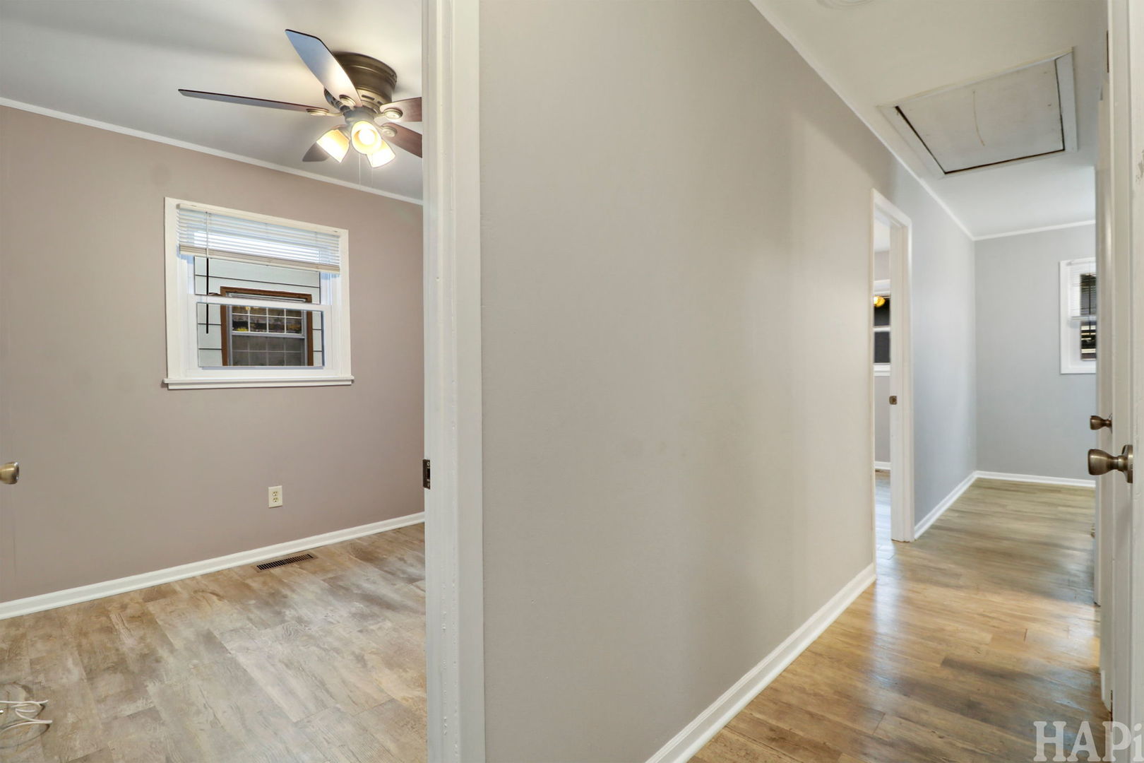 2217 20th Street Zion, IL 60099 - Photo 13 of 24 a view of livingroom with hardwood floor and hallway
