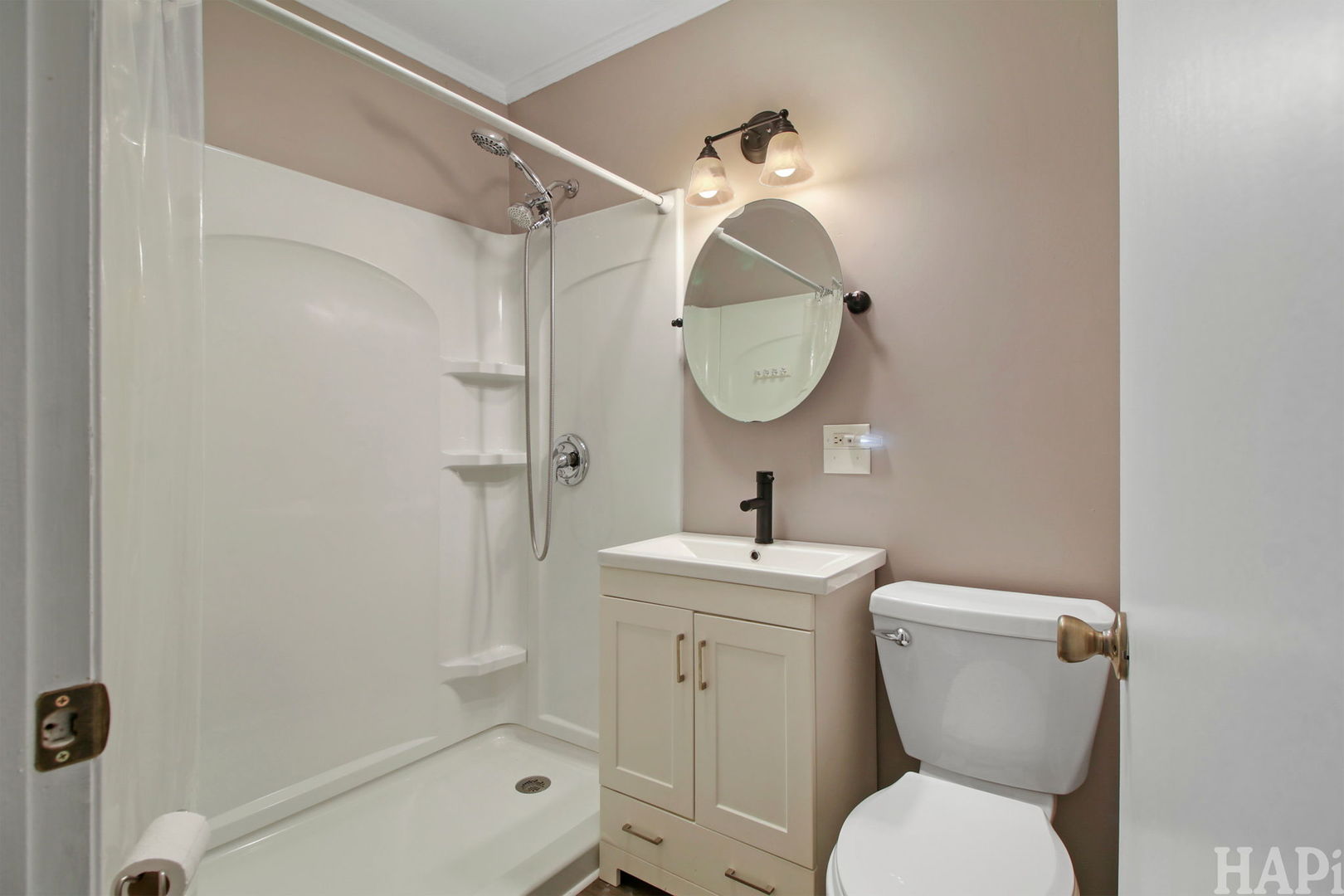 2217 20th Street Zion, IL 60099 - Photo 14 of 24 a bathroom with a toilet sink and mirror