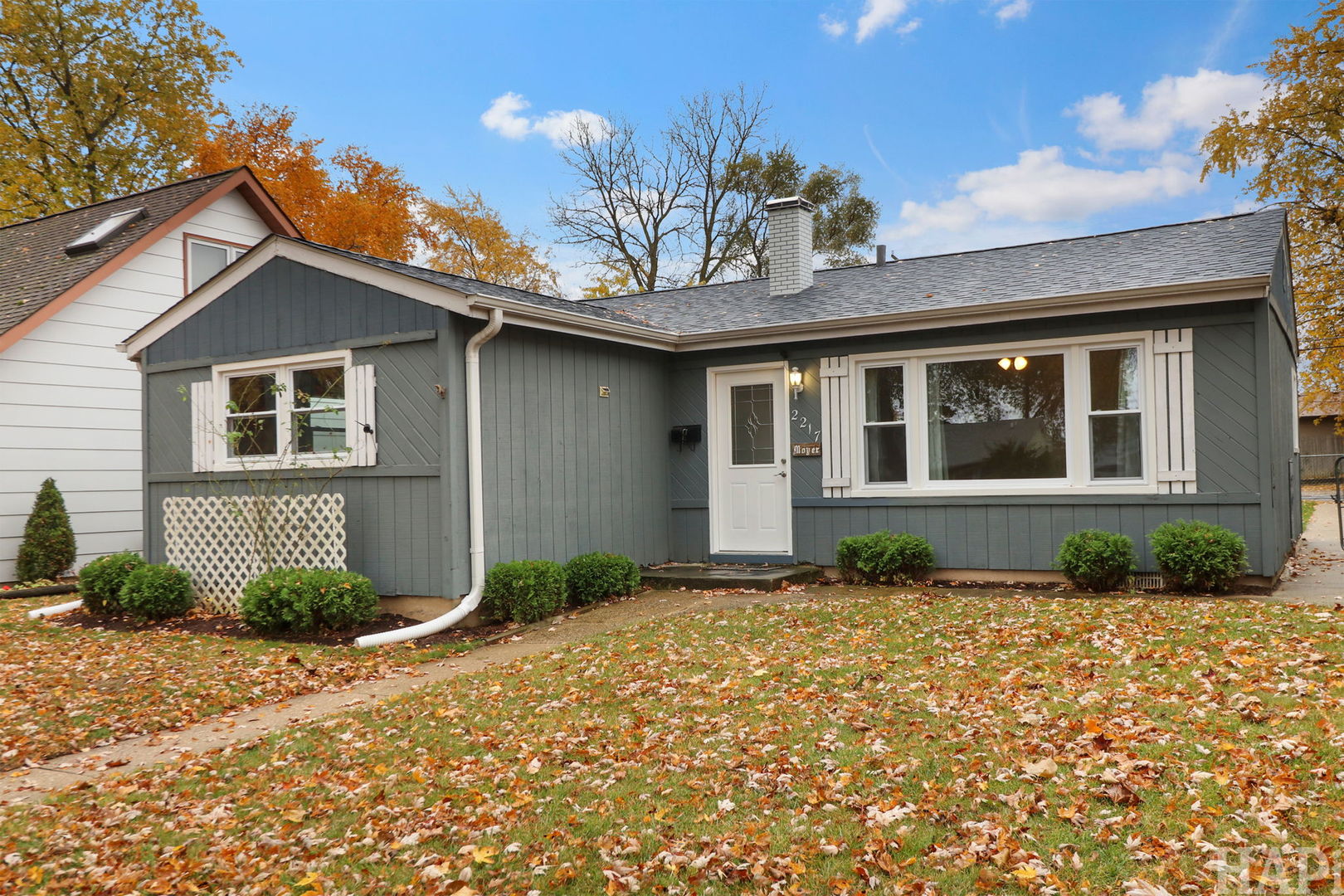 2217 20th Street Zion, IL 60099 - Photo 2 of 24 a front view of a house with garden