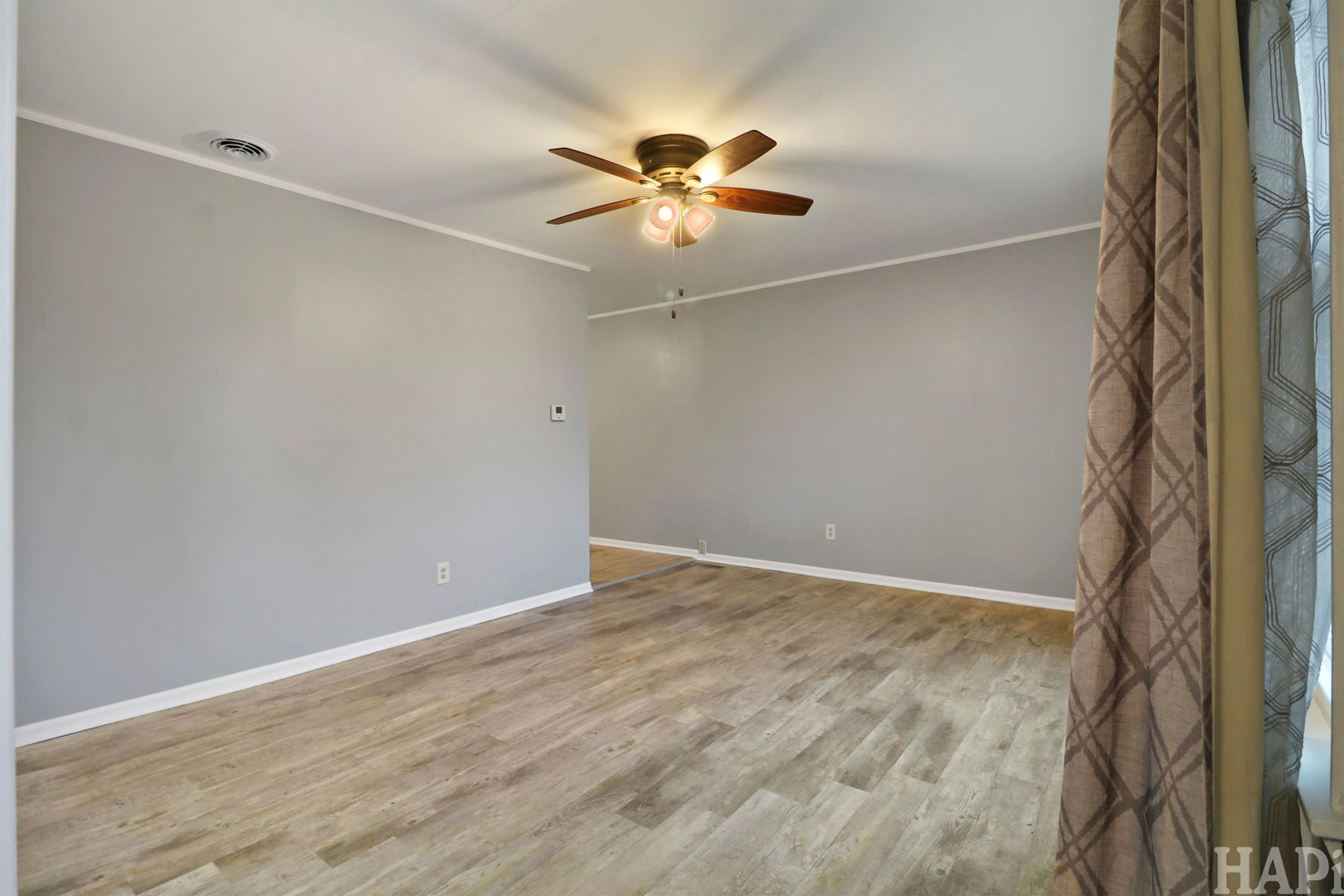 2217 20th Street Zion, IL 60099 - Photo 3 of 24 a view of an empty room with wooden floor
