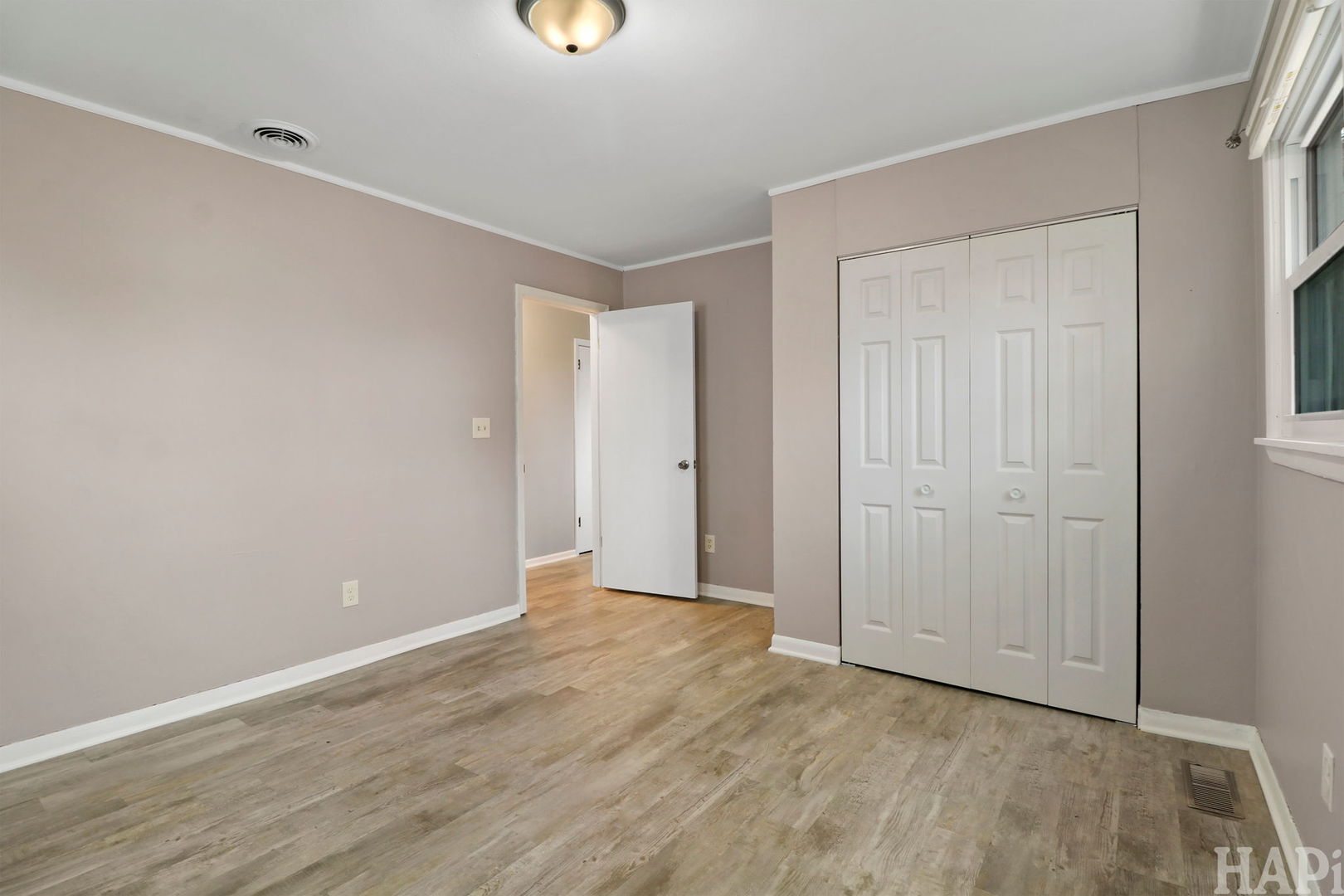 2217 20th Street Zion, IL 60099 - Photo 9 of 24 a view of an empty room with wooden floor