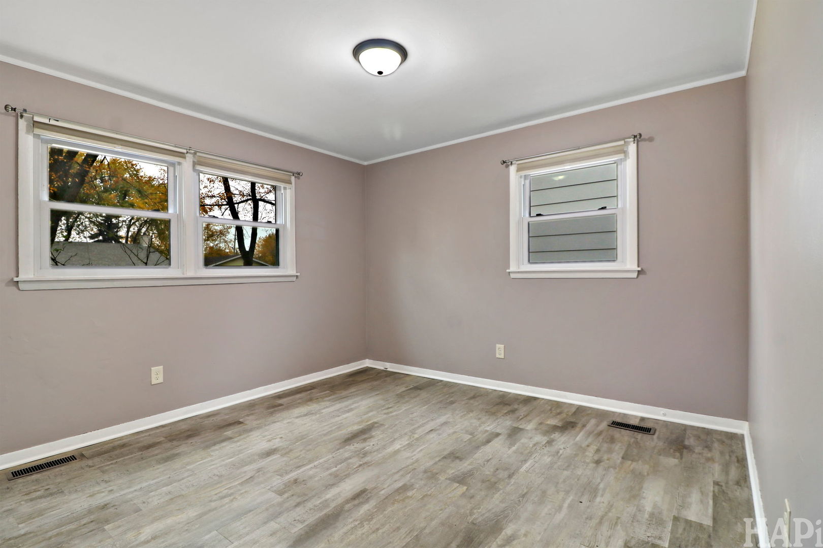 2217 20th Street Zion, IL 60099 - Photo 10 of 24 a view of empty room with windows