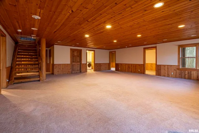 a view of an empty room with a fireplace
