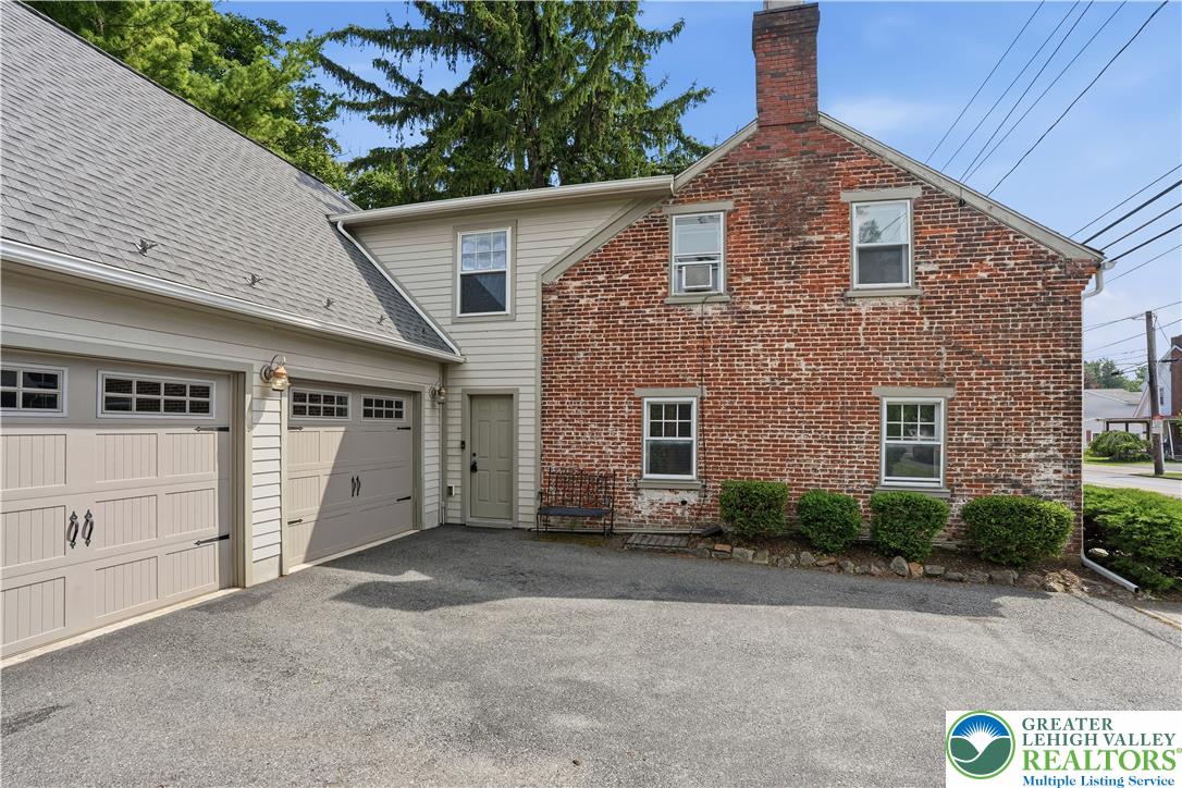 2014 Linden Street Bethlehem, PA 18017 - Photo 76 of 85 A charming brick exterior with a well-maintained driveway leads to an attached two-car garage.