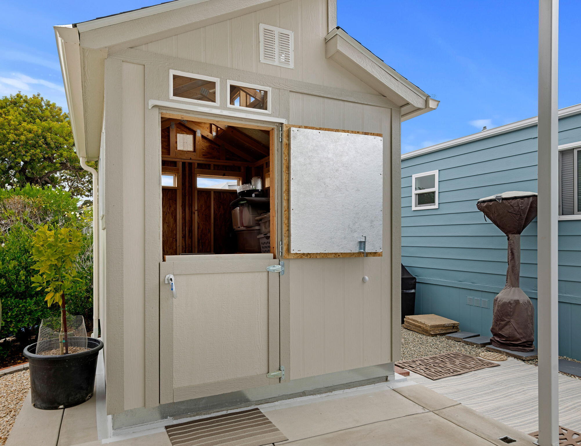 333 Old Mill Road, Unit SPC 79 Santa Barbara, CA 93110 - Photo 24 of 30 a view of a porch with a door and a potted plant