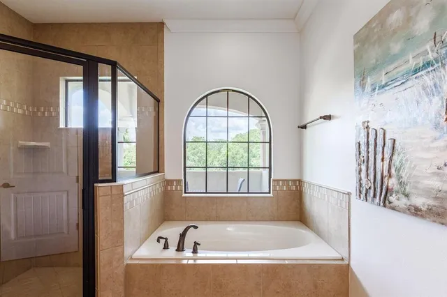 a bedroom with two beds and a chandelier