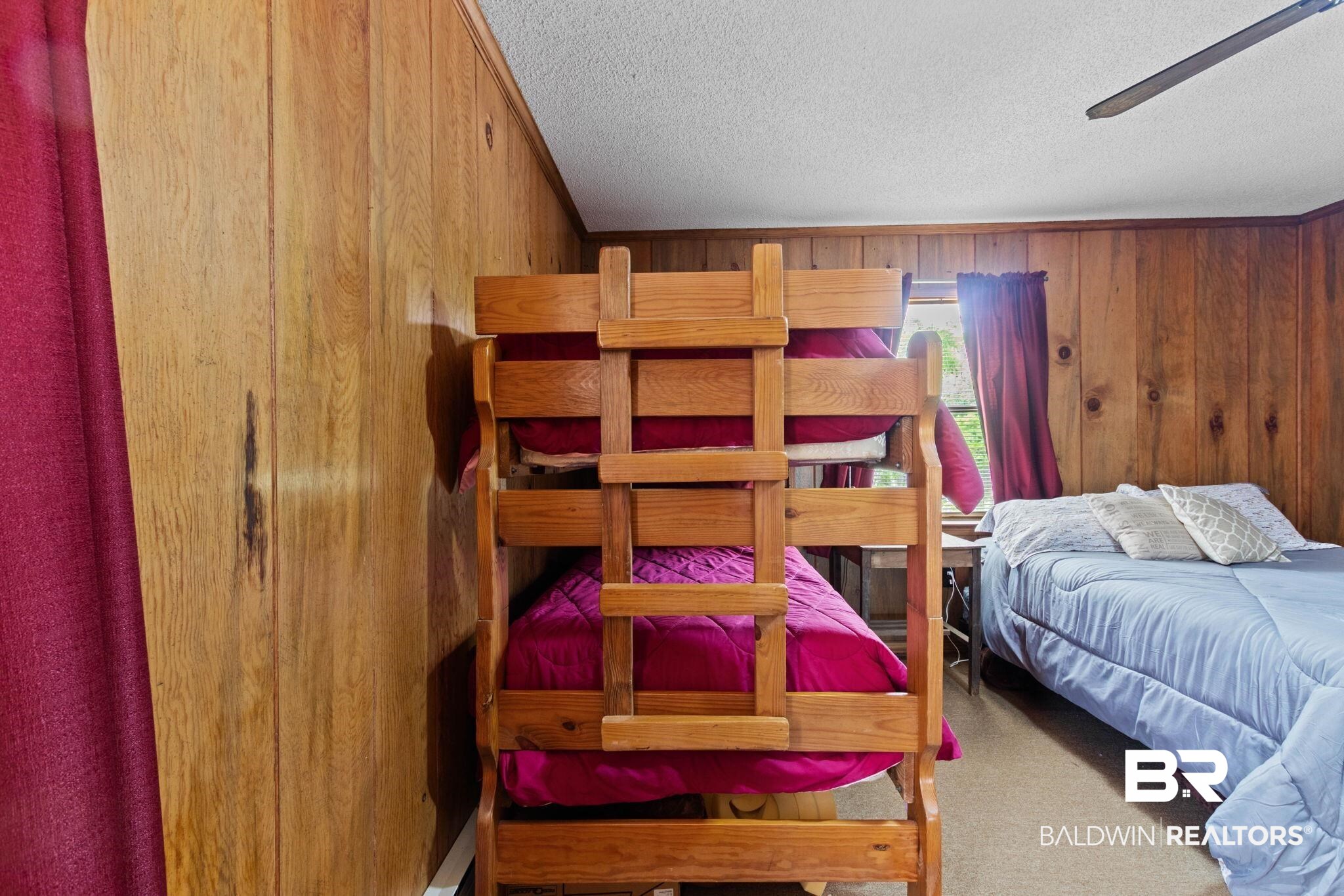 8153 Bryant's Lndg Road Stockton, AL 36579 - Photo 44 of 87 Room featuring wood-paneled walls, a textured ceiling, and a ceiling fan