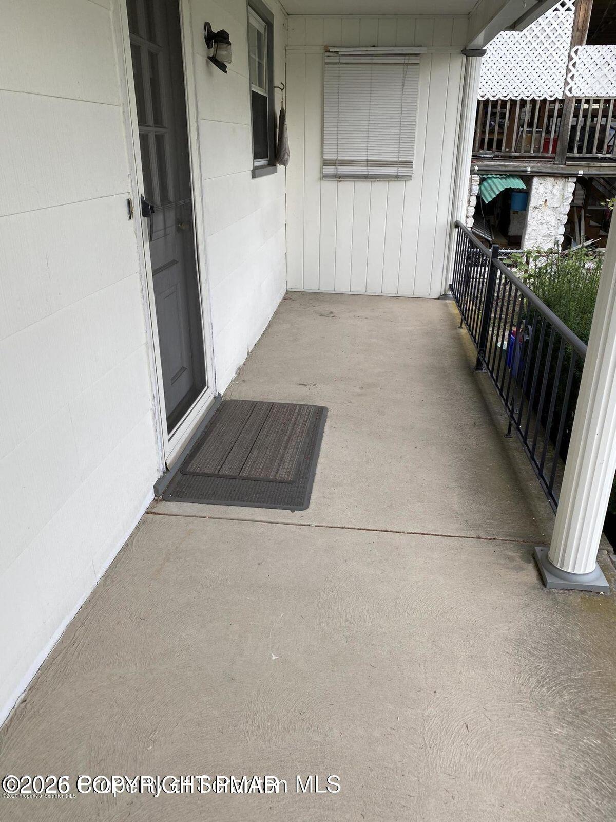 209 West Grace Street Old Forge, PA 18518 - Photo 7 of 8 a view of an empty room with stairs