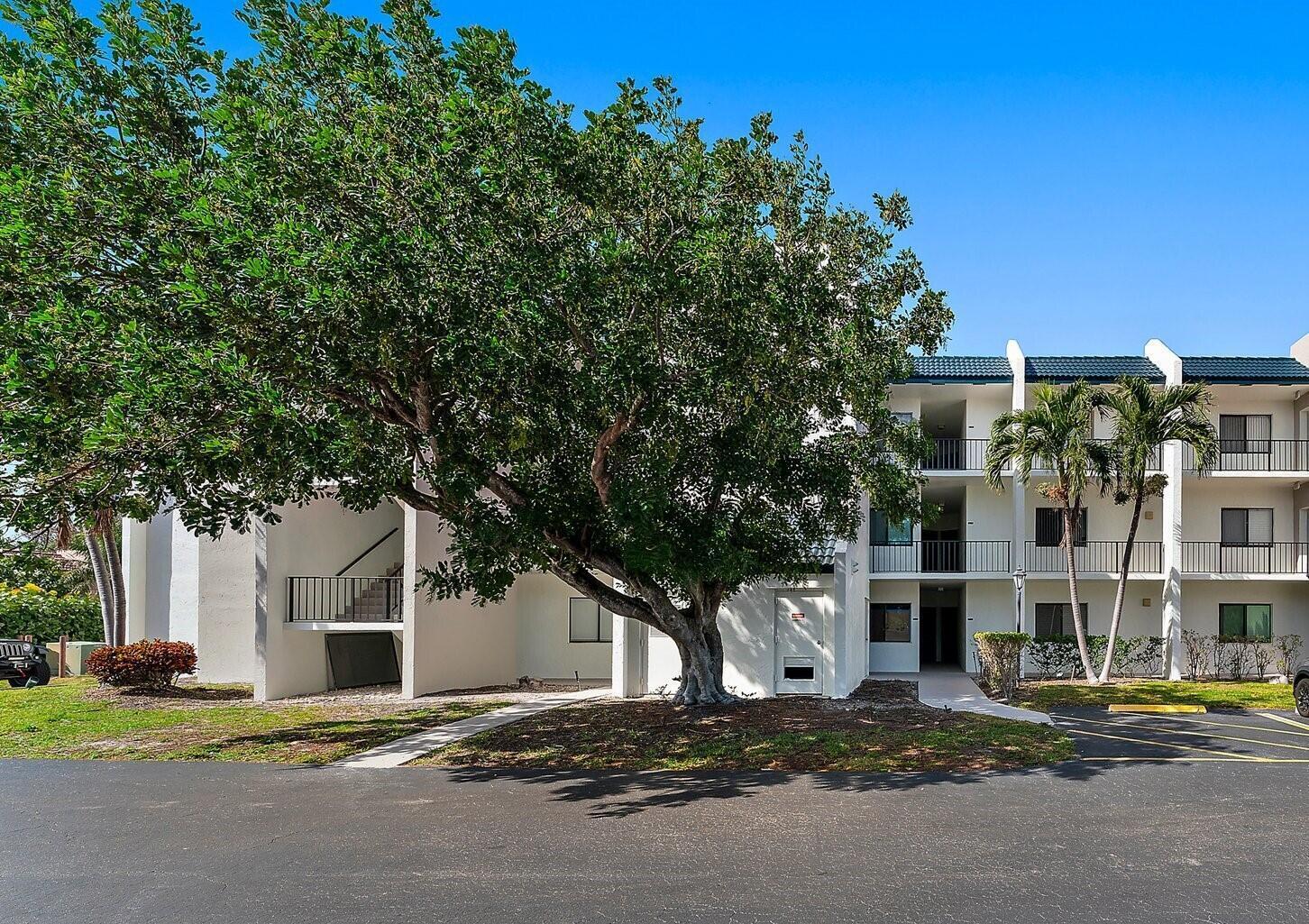 1605 Highway 1, Unit V6306 Jupiter, FL 33477 - Photo 2 of 34 a front view of a building with street view