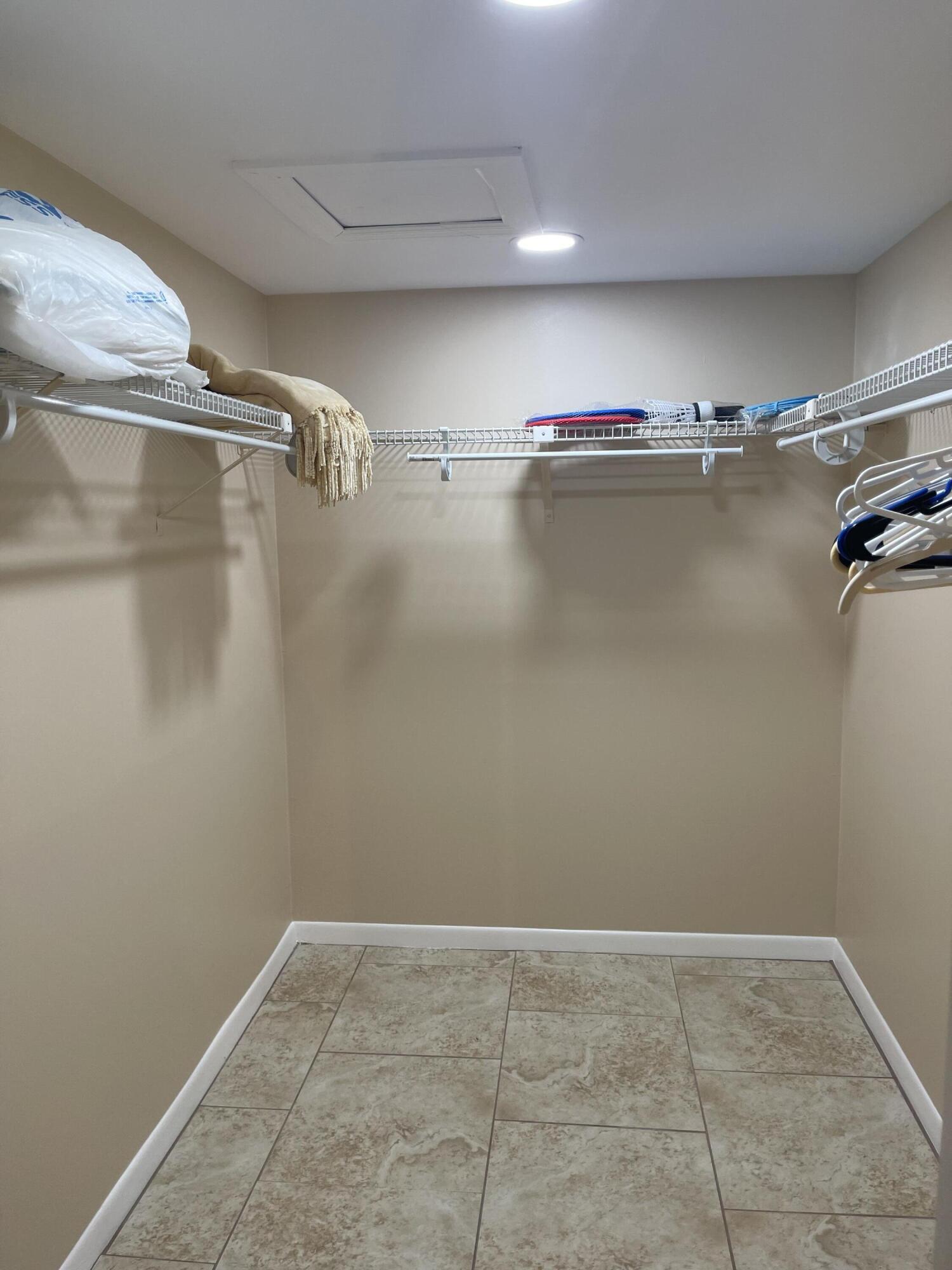 1605 Highway 1, Unit V6306 Jupiter, FL 33477 - Photo 25 of 34 a view of a room with racks on the wall