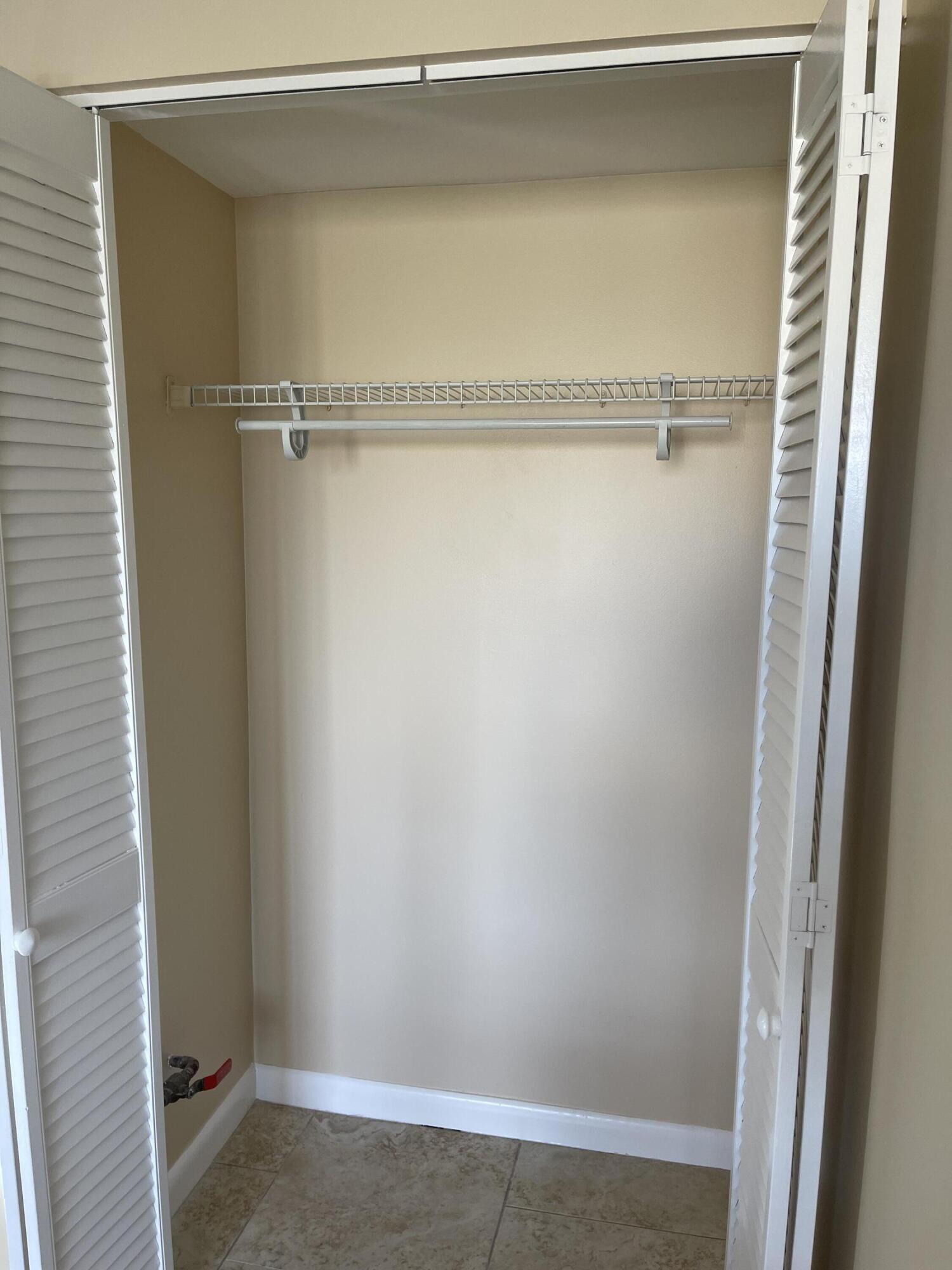 1605 Highway 1, Unit V6306 Jupiter, FL 33477 - Photo 26 of 34 a view of an empty walk in closet