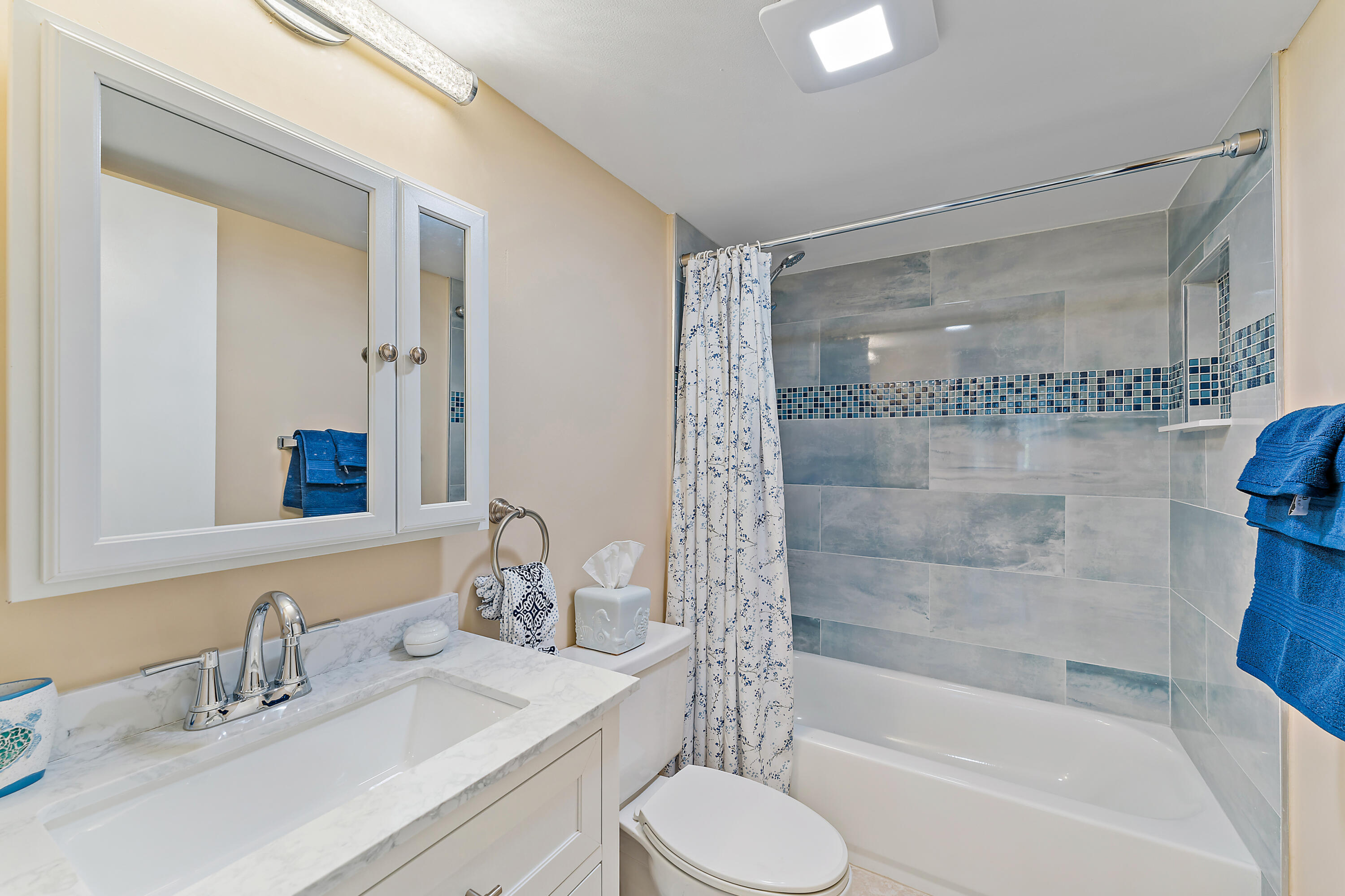 1605 Highway 1, Unit V6306 Jupiter, FL 33477 - Photo 27 of 34 a bathroom with a sink toilet and shower