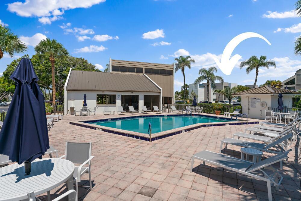 1605 Highway 1, Unit V6306 Jupiter, FL 33477 - Photo 3 of 34 a view of a house with backyard patio and swimming pool