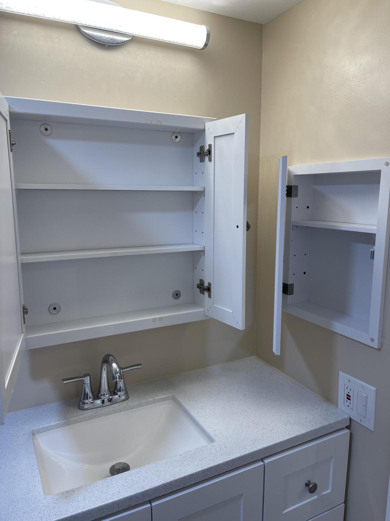 1605 Highway 1, Unit V6306 Jupiter, FL 33477 - Photo 31 of 34 a kitchen with a sink and a cabinets