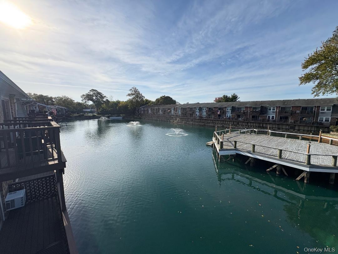 204 Millard Avenue, Unit 204 West Babylon, NY 11704 - Photo 2 of 22 a view of a lake with outdoor space