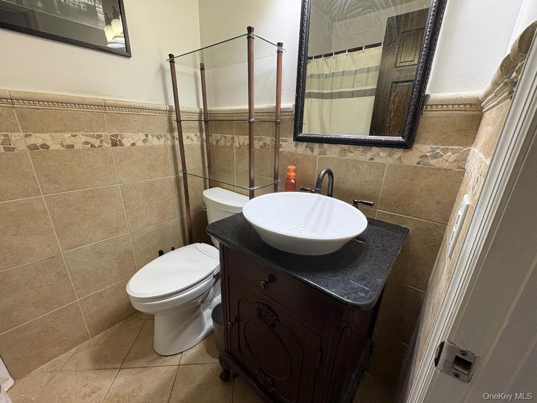 204 Millard Avenue, Unit 204 West Babylon, NY 11704 - Photo 7 of 22 a bathroom with a sink toilet and shower
