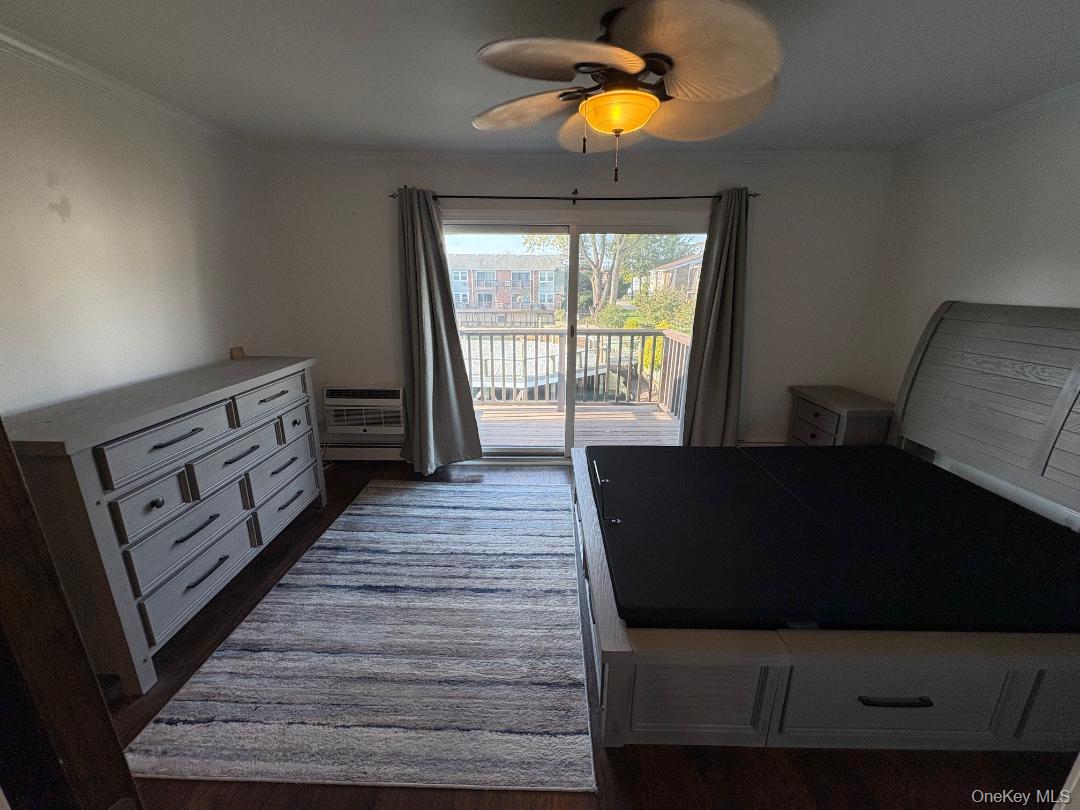 204 Millard Avenue, Unit 204 West Babylon, NY 11704 - Photo 10 of 22 a living room with furniture and a wooden floor