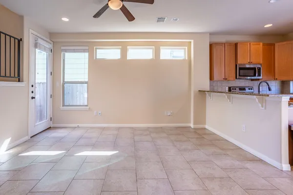 a view of a kitchen with a sink and a window