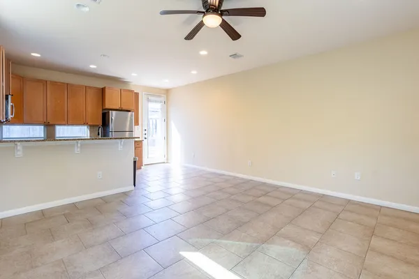 a view of a kitchen with a sink and cabinets