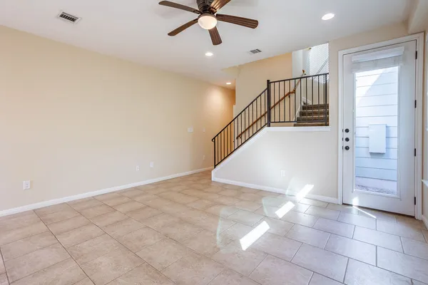 a view of entryway and hall with a front door