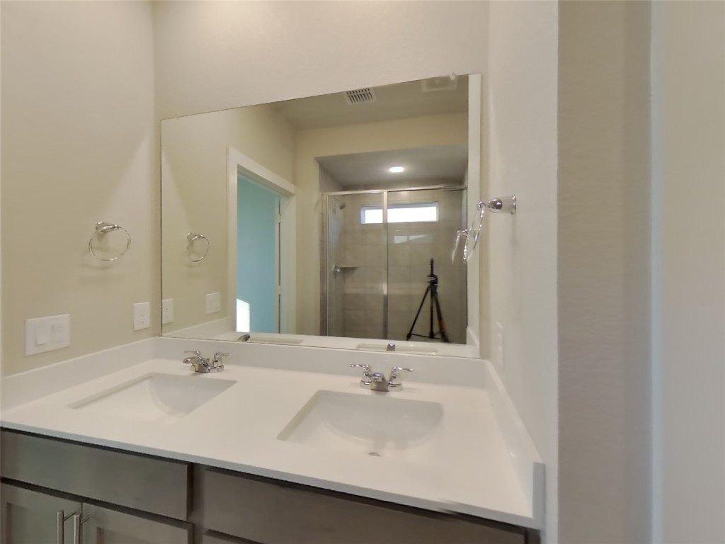620 Raglands Road Leander, TX 78641 - Photo 7 of 30 Full bath featuring a shower stall and double vanity