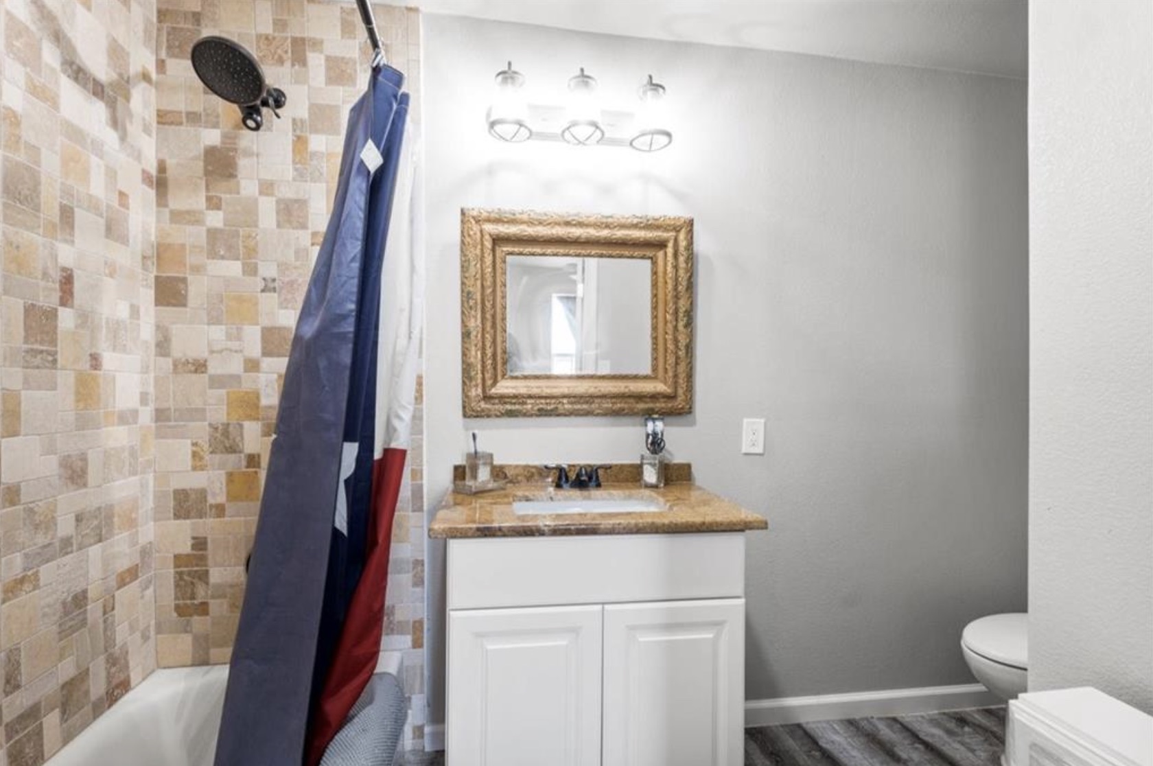 7027 Fm 971 Georgetown, TX 78626 - Photo 21 of 25 a bathroom with a sink and a mirror