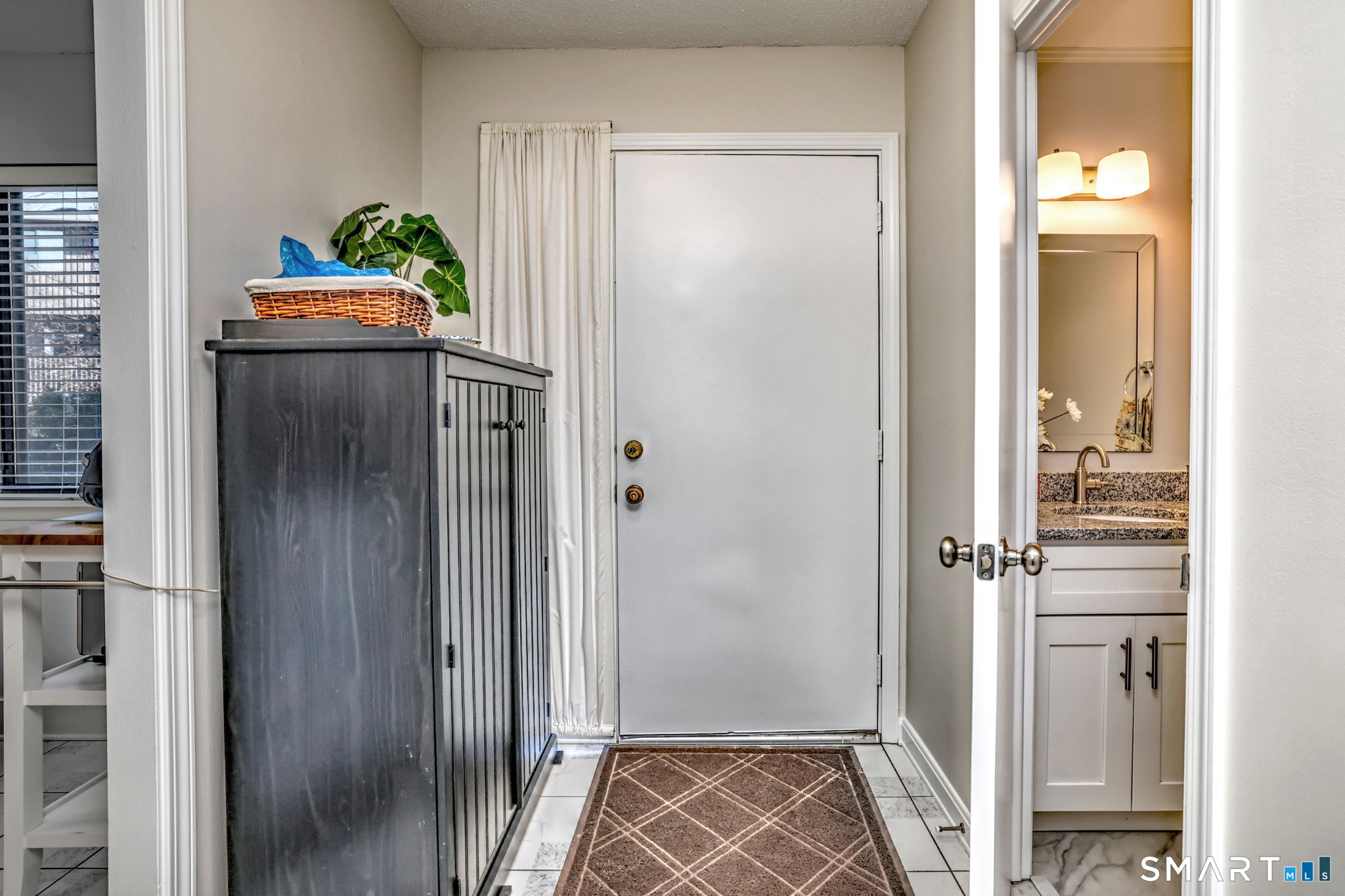 160 Brittany Farms Road, Unit D New Britain, CT 06053 - Photo 2 of 21 Entry way with convenient 1/2 bath of the hall.