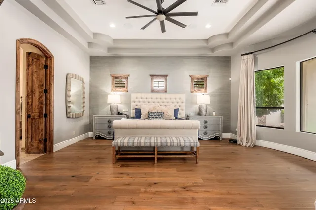 a bathroom with a granite countertop sink a mirror and shower