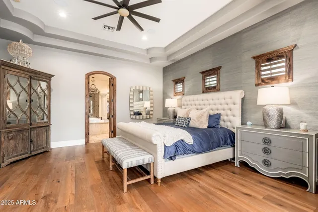 a bathroom with a granite countertop sink a mirror and vanity