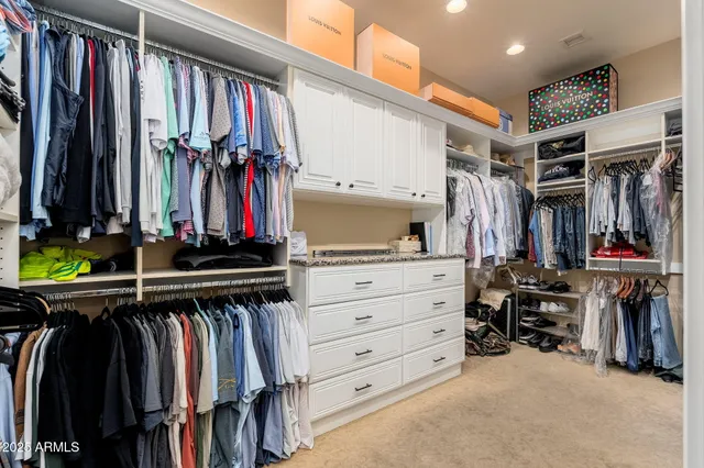 a view of a livingroom with furniture and windows