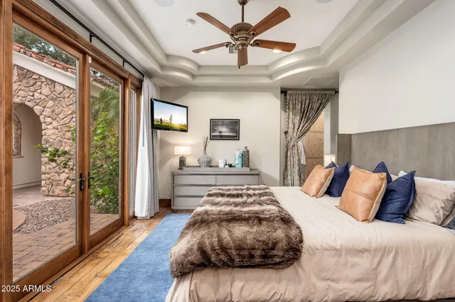 a kitchen with stainless steel appliances granite countertop a kitchen island a stove a sink dishwasher and cabinets with wooden floor