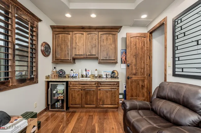 a kitchen with a stove sink and cabinets